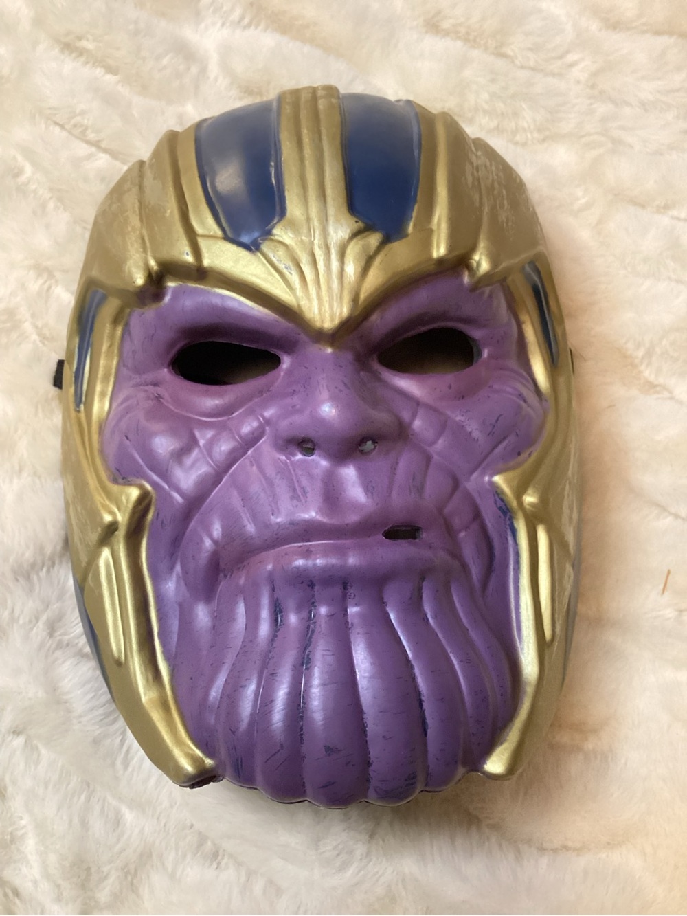 plastic child's Thanos role-play mask inspired by the Marvel Avengers films